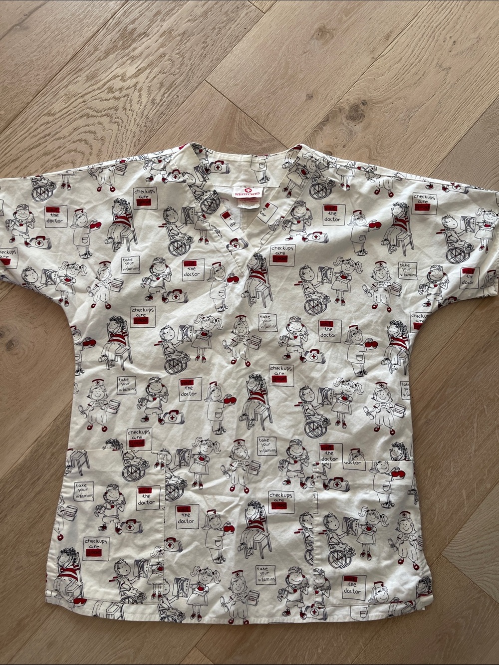 White Cross Scrub Top with Red & Black Medical Cartoon Print size medium